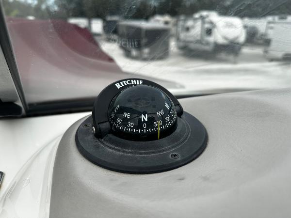Slide: The Image of Ritchie compass on the dashboard of a 2011 Stingray 250 LR boat. - 25