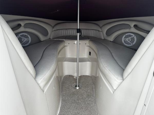 Slide: The Image of Interior cabin of a 2011 Stingray 250 LR boat with cushioned seating. - 31