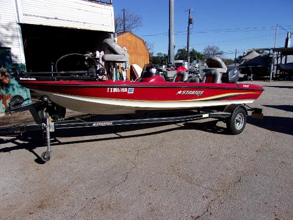 Slide: The Image of 2007 Stratos 176 XT red and white fishing boat on trailer. - 1