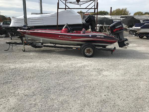 Slide: The Image of 2007 Stratos 285 XL boat on trailer in outdoor storage area. - 1