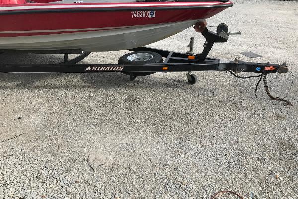 Slide: The Image of 2007 Stratos 285 XL boat trailer with red and white boat. - 18