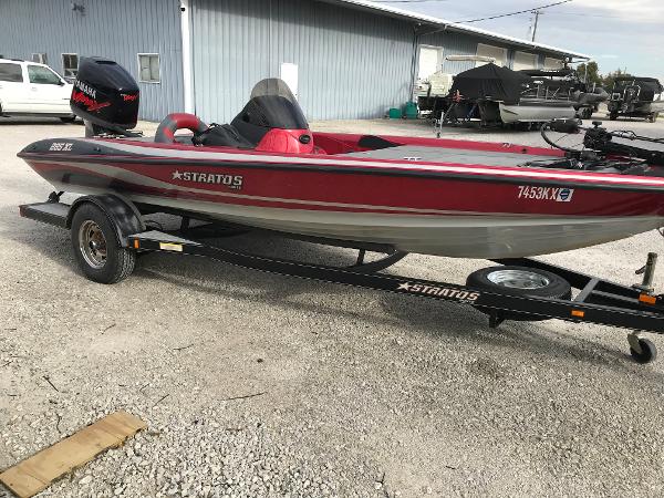Slide: The Image of 2007 Stratos 285 XL red and silver fishing boat on trailer. - 2