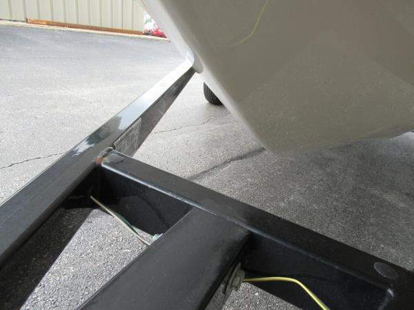 Slide: The Image of 2004 Sugar Sand Tango Xtreme boat on a black trailer. - 6