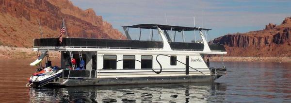 Slide: The Image of Houseboat Desert Rain Trip 15 by American Waterways, 2006, on a serene lake with rocky cliffs. - 1