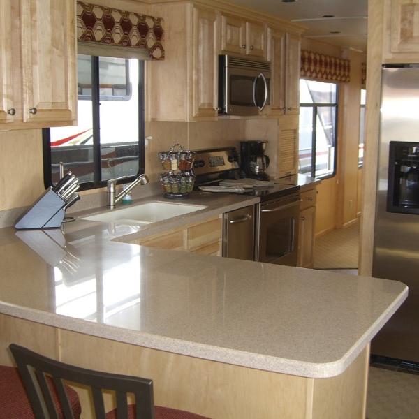 Slide: The Image of Luxurious kitchen interior of 2007 Stardust Cruisers Sundancer Trip 7 houseboat. - 2