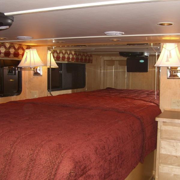 Slide: The Image of Luxurious bedroom interior of 2007 Stardust Cruisers Sundancer Trip 7 houseboat with elegant lighting. - 4