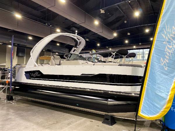 Slide: The Image of 2024 SunChaser Calais 23 SB DC pontoon boat displayed indoors. - 1