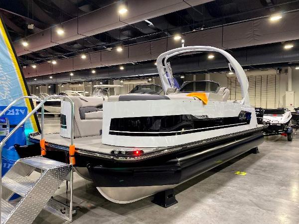 Slide: The Image of 2024 SunChaser Calais 23 SB DC pontoon boat displayed indoors. - 2