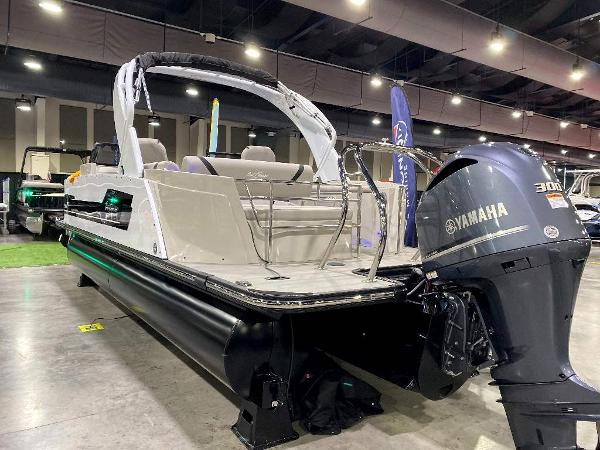 Slide: The Image of 2024 SunChaser Calais 23 SB DC pontoon boat with Yamaha 300 outboard motor displayed indoors. - 3