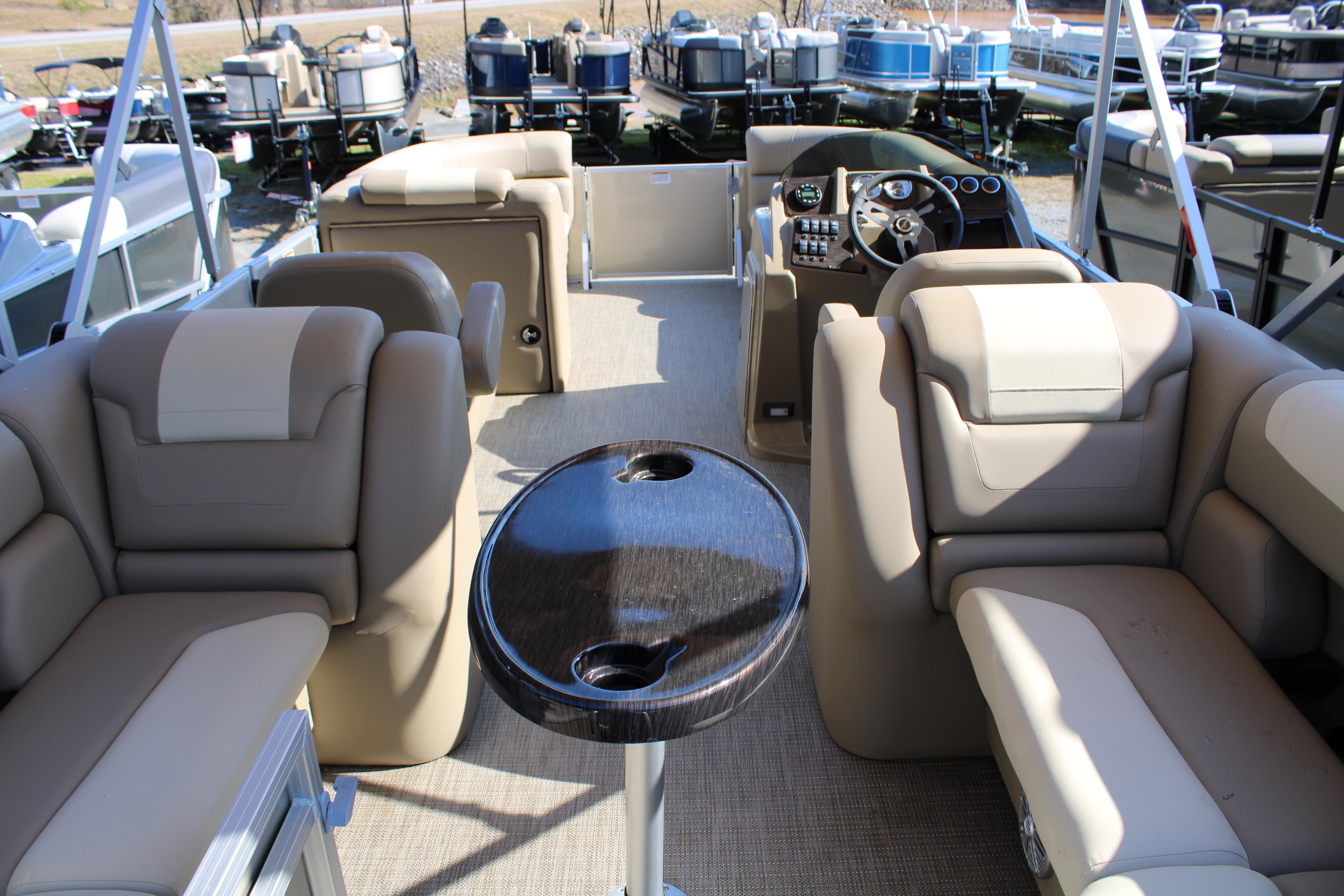 Slide: The Image of 2023 SunChaser Geneva Cruise 22 LR DH interior with beige seating and central table. - 10