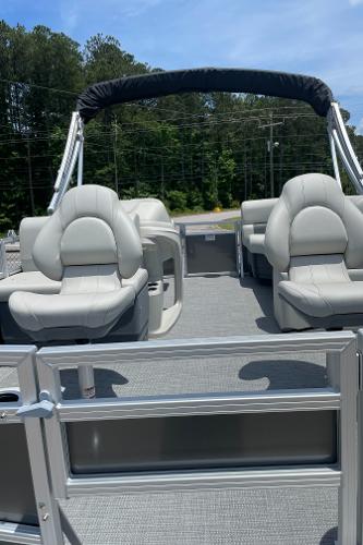 Slide: The Image of 2023 SunChaser Vista 16 Fish pontoon boat with comfortable seating and canopy. - 2