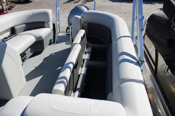 Slide: The Image of 2024 SunChaser Vista 22 LR pontoon boat interior with spacious seating and storage compartments. - 11