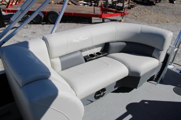 Slide: The Image of 2024 SunChaser Vista 22 LR boat interior with gray cushioned seating and cup holders. - 12