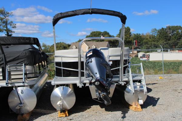 Slide: The Image of 2024 SunChaser Vista 22 LR pontoon boat with outboard motor on display. - 3