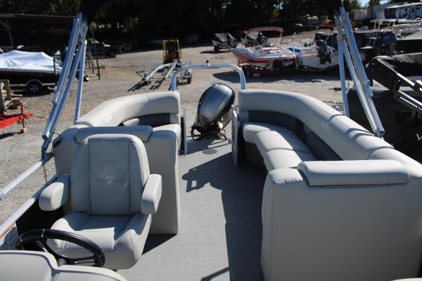 Slide: The Image of 2024 SunChaser Vista 22 LR pontoon boat with spacious seating and modern design. - 9