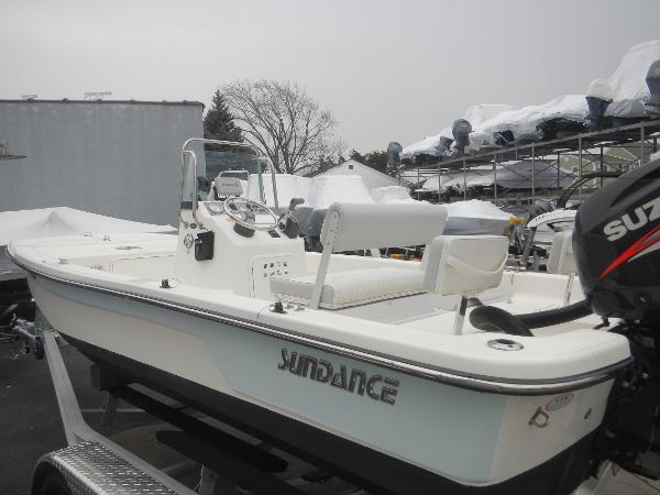 Slide: The Image of 2016 Sundance 17 Center Console boat on trailer, equipped with Suzuki outboard motor. - 0