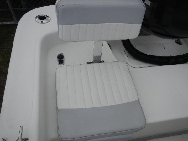 Slide: The Image of 2016 Sundance 17 Center Console boat seat with white and gray upholstery. - 10