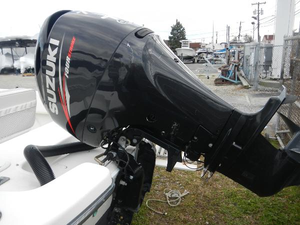 Slide: The Image of 2016 Sundance 17 Center Console with Suzuki outboard motor. - 12