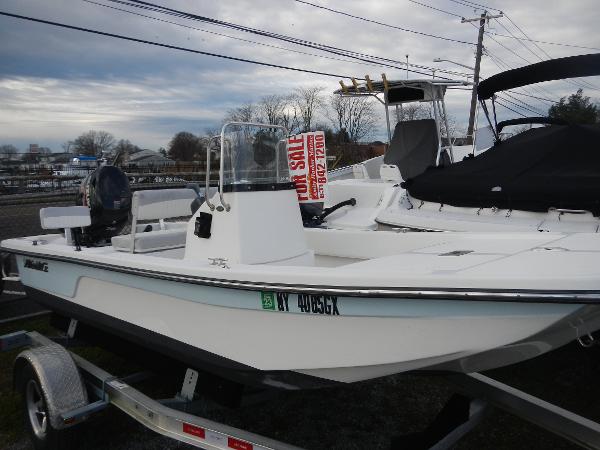 Slide: The Image of 2016 Sundance 17 Center Console boat for sale on a trailer. - 2