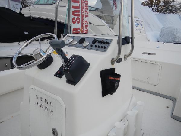Slide: The Image of 2016 Sundance 17 Center Console boat dashboard and controls. - 8