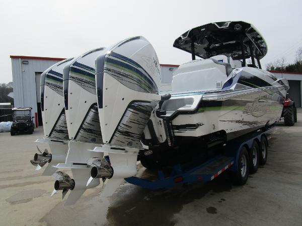Slide: The Image of 2024 Sunsation 40CCX powerboat with triple outboard engines on a trailer. - 11