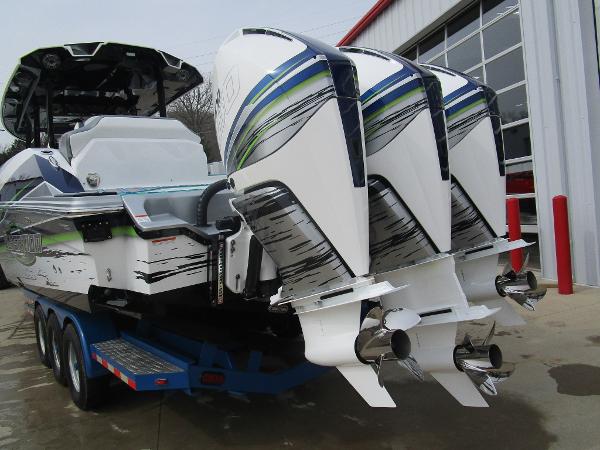 Slide: The Image of 2024 Sunsation 40CCX boat with triple outboard engines on a trailer. - 13