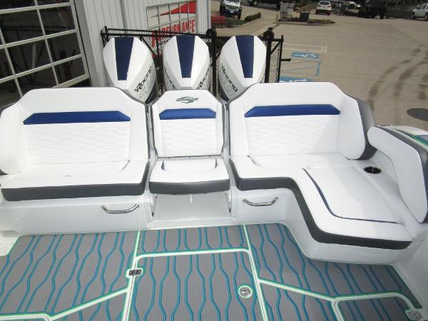 Slide: The Image of Sunsation 40CCX 2024 boat with triple outboard engines and luxurious seating. - 17