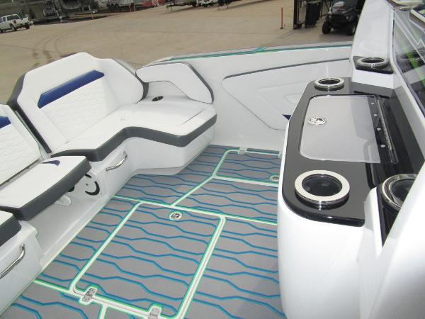 Slide: The Image of 2024 Sunsation 40CCX boat interior with seating and cup holders. - 18