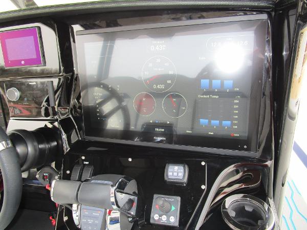 Slide: The Image of 2024 Sunsation 40CCX boat dashboard with advanced touchscreen controls and gauges. - 26