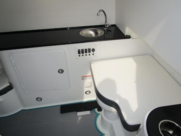 Slide: The Image of 2024 Sunsation 40CCX boat interior with kitchenette and seating area. - 39