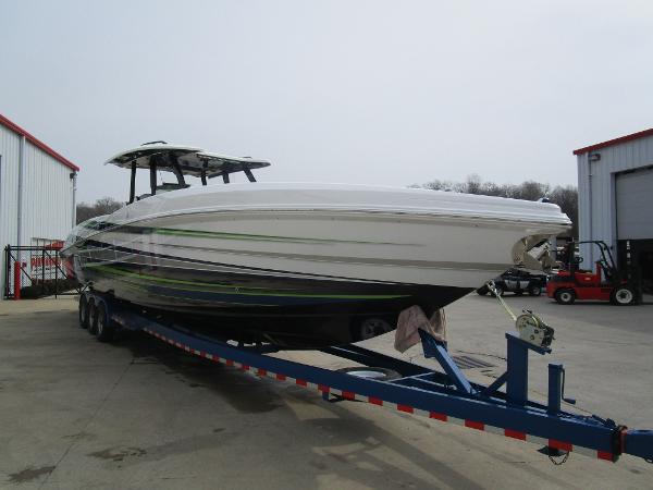 Slide: The Image of 2024 Sunsation 40CCX boat on a trailer outside a warehouse. - 6
