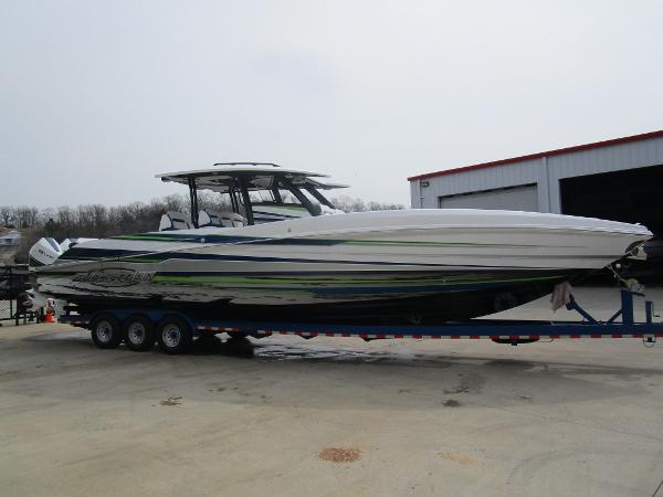 Slide: The Image of 2024 Sunsation 40CCX powerboat on a trailer outside a warehouse. - 8