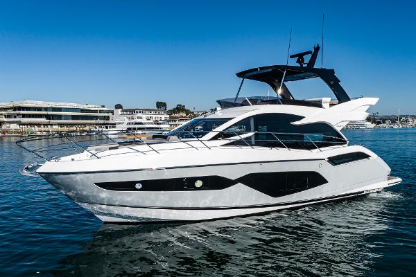 Slide: The Image of 2022 Sunseeker Manhattan 55 yacht on water, modern design, luxury vessel. - 0