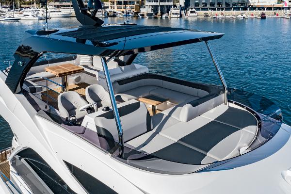 Slide: The Image of 2022 Sunseeker Manhattan 55 luxury yacht with spacious deck and seating area. - 10