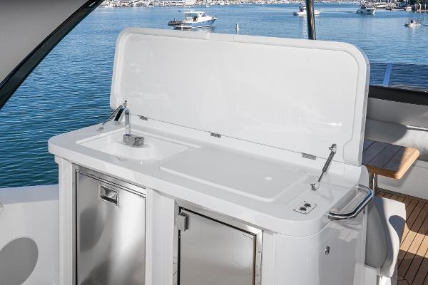 Slide: The Image of Outdoor kitchenette on 2022 Sunseeker Manhattan 55 yacht with sink and storage. - 13