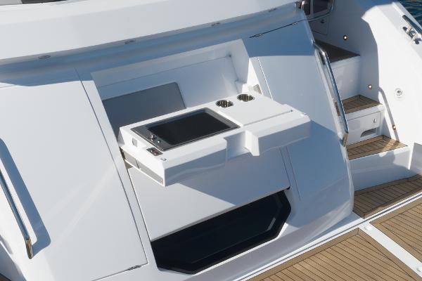 Slide: The Image of Outdoor kitchen on the 2022 Sunseeker Manhattan 55 yacht with a built-in grill and sink. - 14