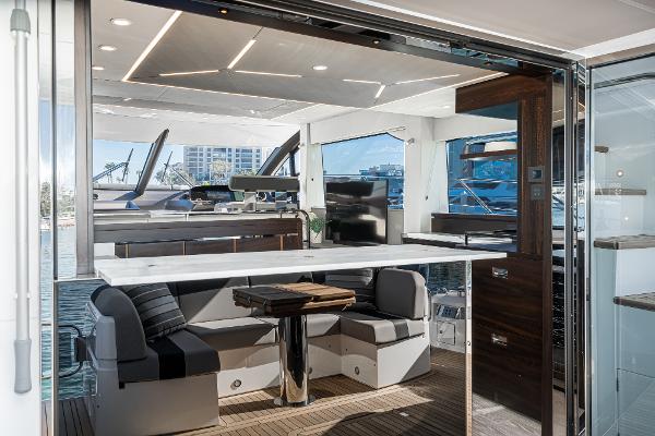 Slide: The Image of Luxurious interior of 2022 Sunseeker Manhattan 55 yacht with modern seating and dining area. - 18