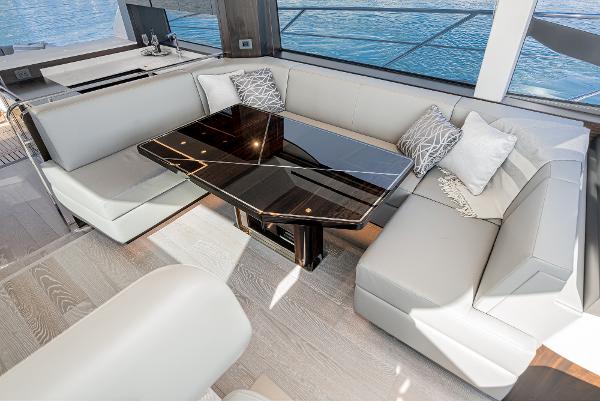 Slide: The Image of Luxurious interior of 2022 Sunseeker Manhattan 55 yacht with elegant seating and modern table. - 22