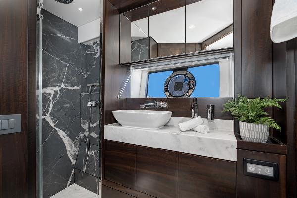 Slide: The Image of Luxurious bathroom in 2022 Sunseeker Manhattan 55 yacht with marble accents and modern fixtures. - 35
