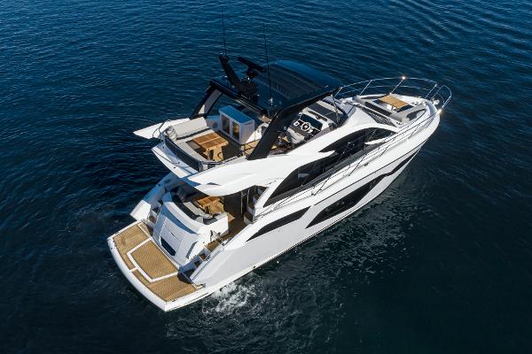 Slide: The Image of 2022 Sunseeker Manhattan 55 yacht cruising on open water. - 37