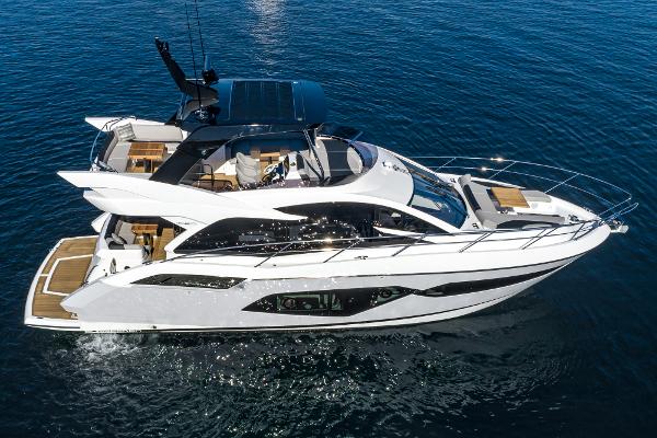 Slide: The Image of 2022 Sunseeker Manhattan 55 yacht cruising on open water. - 38