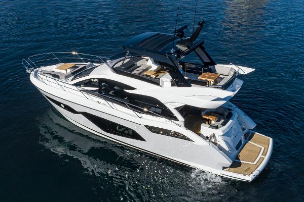 Slide: The Image of 2022 Sunseeker Manhattan 55 yacht cruising on open water. - 39