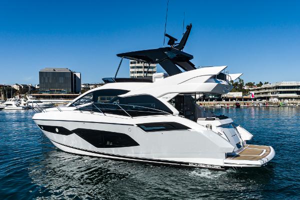 Slide: The Image of 2022 Sunseeker Manhattan 55 yacht in a marina. - 5