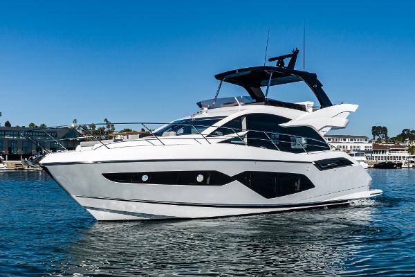 Slide: The Image of 2022 Sunseeker Manhattan 55 yacht cruising on a sunny day. - 7