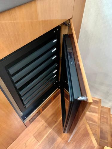 Slide: The Image of Built-in wine cooler on a 2016 Sunseeker Manhattan 65 yacht. - 11