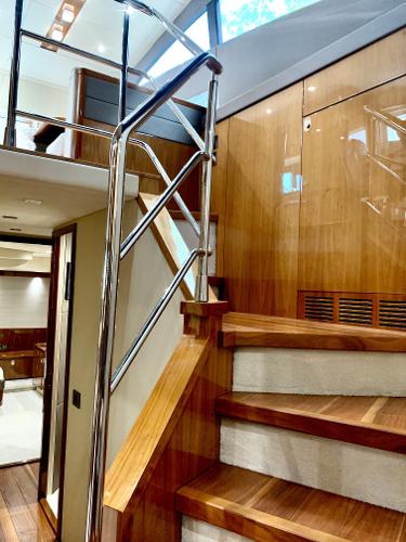 Slide: The Image of Interior staircase of a 2016 Sunseeker Manhattan 65 yacht with wooden finish. - 12