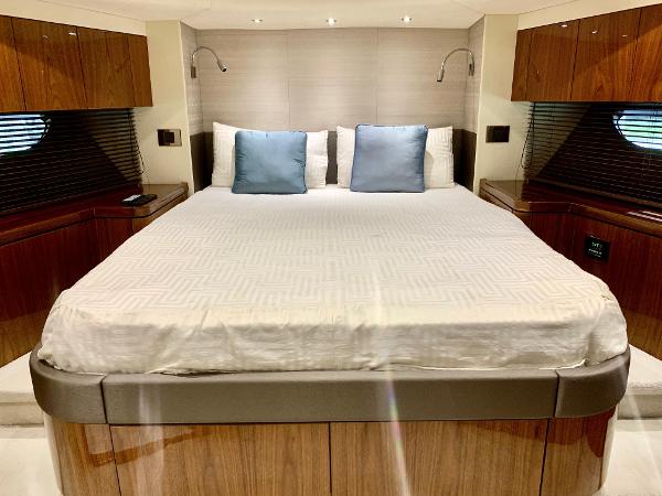 Slide: The Image of Luxurious master bedroom in 2016 Sunseeker Manhattan 65 yacht with modern wood finishes. - 17