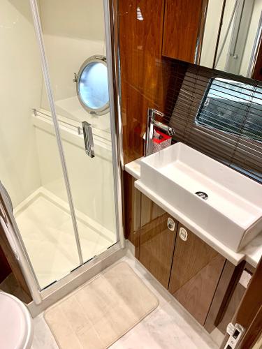 Slide: The Image of 2016 Sunseeker Manhattan 65 yacht bathroom with shower and modern sink. - 19
