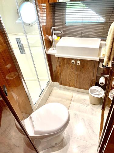 Slide: The Image of 2016 Sunseeker Manhattan 65 yacht bathroom with modern fixtures and shower. - 22