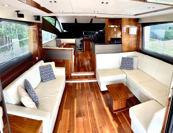 Slide: The Image of Luxurious interior of 2016 Sunseeker Manhattan 65 yacht with wooden flooring and white sofas. - 3
